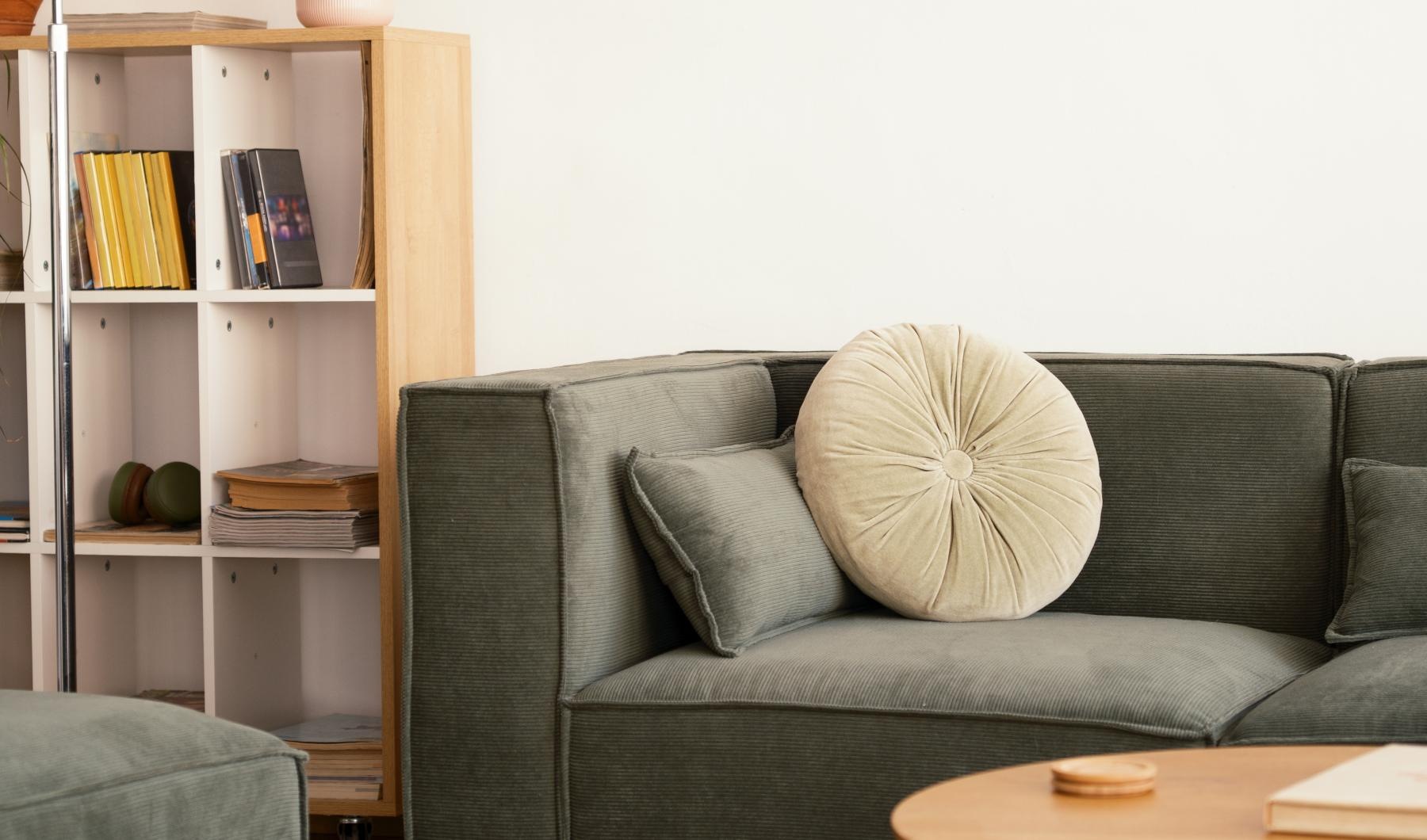 a living room with a green couch